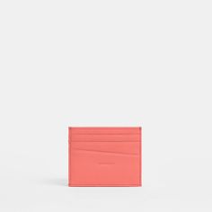 This unisex cardholder features room for four credit cards and an ID, in addition to a flat center pocket for folded bills. Crafted with hot pink pebbled leather. Crafted with hot pink pebbled leather Red cotton twill lining 4" L x 0.25" W x 3.25" H Cardholder Wallet, Card Holder Wallet, Pink Stripes, Credit Cards, Card Wallet, Pebbled Leather, Cotton Twill, Women's Accessories, Wallets