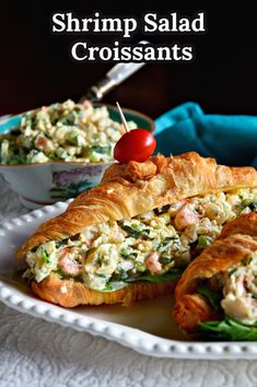 shrimp salad croissants on a white plate