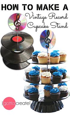 there is a cake stand with cupcakes on it and an old record player