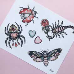 some bugs and ladybugs stickers on top of a piece of white paper