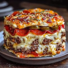 a layered lasagna on a plate ready to be eaten for lunch or dinner