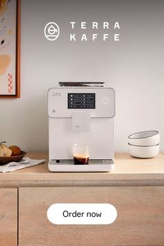 a coffee machine sitting on top of a wooden counter