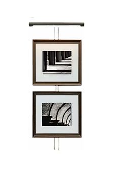 two framed pictures hanging on the wall next to each other, one is black and white