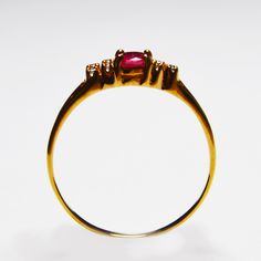 Natural Red Ruby Anniversary Ring {Natural African Treated Ruby} Pigeon Blood Ruby Dimension Of the stones {Ruby} : 4 x 5 mm Oval Shape 0.45 Ct total weight of the stones Secondary Stones : Natural White Zircon {8 Pcs 1.3mm Round } Whole Ring Weight : 1.56 g . Ring Size : UK O1/2, US 8 . Handcrafted with solid 9 K fine Gold . The band for Girl/Women individually hand-set with 4x5 mm size stone Oval shaped Natural Ruby July Birthstone birthstone . Total 9 Gemstones - Cluster Setting . This Ruby 9K Beautiful ring is timeless and stylish. Every piece passes rigorous inspection. So you can buy with confidence. A fantastic gift for Engagement, Anniversary Gift, Christmas's Day, Birthdays, Graduation, Valentine's Day,Mother's Day If you have any question please message us . Thanks for stopping u Gift For Engagement, Blood Ruby, Ruby Anniversary, Timeless Ring, Ring Ruby, July Birthstone, Red Ruby, Engagement Anniversary, Beautiful Ring