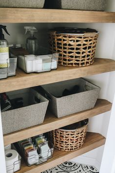 the shelves are organized with baskets and toiletries