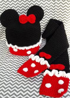 two crocheted mickey mouse hats and booties