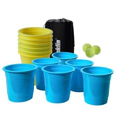 blue plastic cups with yellow rims and a black bag are next to tennis balls