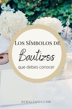 a table with white flowers and napkins on it that says los simbolos de bauties