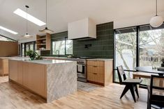 41 Midcentury Modern Kitchen Ideas for Your Home Stacked Subway Tile Kitchen, Vertical Stacked Subway Tile Kitchen, Stacked Tile, Midcentury Modern Kitchen, Green Kitchen Ideas, Apartment Size Refrigerator, Green Subway Tile, Dark Green Kitchen, Green Backsplash