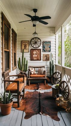 a porch with wooden furniture and plants on the front porch, including an old wagon wheel