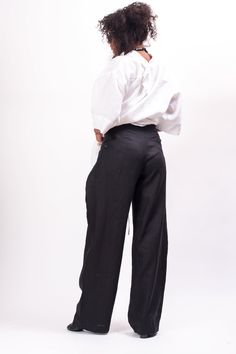 Inspire them all in the Black wide leg linen pants women. These tall Black wide leg linen pants women feature a mid waisted construction with front botton and zipper closure, two pockets. Perfect for work and daily life. This women's trousers feature a men's classic cut with an avant-garde wrapping of the sides around the hips. High rise with a Black wide leg linen pants women, you'll be at your highest comfort level without compromising style. Wear these mid waisted pants women with a flowy cro Wide-leg Linen Harem Pants For Work, Linen Wide Leg Harem Pants For Work, Versatile High Waist Linen Wide Leg Pants, Baggy High Waist Linen Wide Leg Pants, Baggy Linen Wide-leg Pants, Versatile Wide Leg Linen Pants, Baggy Wide Leg Linen Pants, High-waisted Linen Harem Pants, Baggy High-waisted Linen Wide Leg Pants