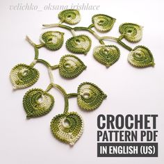 the crochet pattern is in english and has many leaves on it, as well as flowers