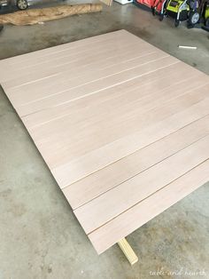 the unfinished plywood is ready to be cut and put into place in the garage