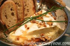 bread and cream in a metal bowl on a table