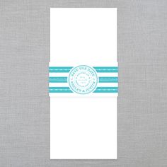 a white and blue striped pocketfold with a label on the front that says,