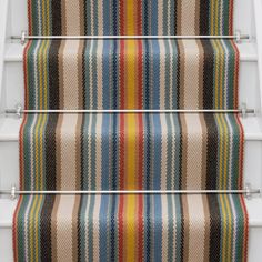 the stair treads are painted with multicolored stripes