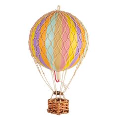 a multicolored hot air balloon sitting on top of a basket