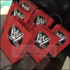 red paper bags with black and white designs on them