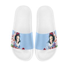 a pair of women's white and blue slippers with snow queen on them