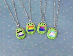 Funny Handmade LGBTQ+ Frog Necklace made by me of Polymer Clay.No matter how old are you, it can be funny gift for everyone (:Approximate dimensionsNecklace:height: 2.5 cm. (  1"  )width:  2 cm.  (  0.8"  )chain length : 45cm. ( 18" )-Jewelry packed in little brown crafts box (:-All my jewelry are completely handmade so it can be slightly different than shown on the pictures.-Notice. Polymer clay love water but metal parts are not waterproof, so please avoid direct contact with water (like swimm Gay People Gifts, Lgbtq Frog, Goblincore Jewelry, Lesbian Gifts, Frog Necklace, Gay Pride Gifts, Packing Jewelry, Non Binary, Cute Clay