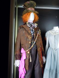 two mannequins dressed up in fancy clothing