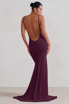 the back of a woman in a purple dress