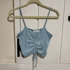 Nwt. Nbw. Luca And Grae Cropped Tank. Ribbed. Tie Front. Size S Spring Cotton Drawstring Tank Top, Casual Blue Top With Drawstring, Fitted Blue Top With Drawstring, Blue Cotton Drawstring Tops, Spring Blue Ruched Tank Top, Blue Ruched Sleeveless Top, Blue Ruffled Straps Tank Top, Blue Tie-back Sleeveless Tank Top, Blue Seamless V-neck Camisole