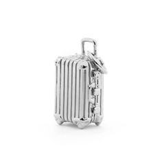 The jetsetter’s number one travel accessory? Their tried and true rollie suitcase. Based on the iconic, German-engineered fan favorite, our replica Rimowa suitcase comes complete with handle, latch, lock, and corner bumper details. Unpack some whimsy with a case that opens to reveal chain luggage straps. Where will you go next? Approximate dimensions: 21 mm x 9.8 mm Silver Rectangular Luggage With Sleeve, Rimowa Suitcase, Luggage Straps, Tried And True, Pure Silver, Travel Accessories, Precious Metals, Number One, Fan