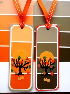 two tags with trees and pumpkins on them