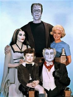 a group of people dressed up as the addams