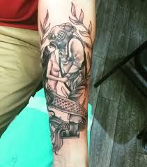 a person with a tattoo on their arm