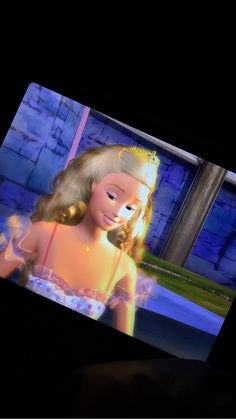 a barbie doll is shown on the screen