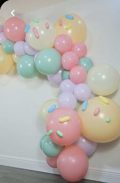 a bunch of balloons that are on the wall