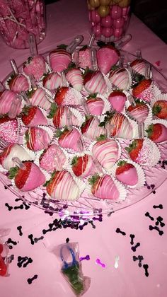 a platter filled with lots of chocolate covered strawberries