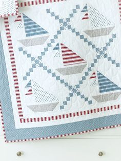 Ahoy quilters! Set sail on a quilting adventure with our charming Set Sail Quilt Pattern, ideal for baby quilts, crib quilts and beautiful bed quilts. This delightful quilt pattern features easy-to-make sailboats accented with the timeless beauty of an Irish chain design, creating a nautical masterpiece that’s perfect for quilters of all skill levels, 4 sizes included. Boy Quilt Patterns, Baby Quilts Easy, Boat Quilt, Baby Boy Quilt Patterns, Throw Quilts, Boys Quilt Patterns, Crib Quilts, Quilts Easy