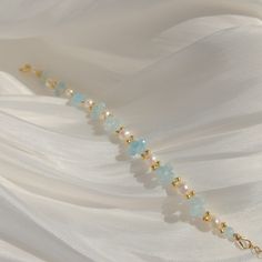 Capture the summer breeze with this charming Aquamarine and Pearl bracelet. Handcrafted with various shades of blue aquamarine and genuine pearls, it's the perfect accessory to elevate your look. Enjoy the beauty and elegance of this bracelet wherever the summer takes you. Details 4.5-5mm freshwater pearls. Blue aquamarine beads. 14k gold filled. Wanna browse more of my bracelet series? https://www.etsy.com/ca/shop/PrettyPearlfect?section_id=31793519 Take a look at my shop to discover more piece Delicate Adjustable Blue Beaded Bracelets, Elegant Hand-strung Beaded Bracelets For Beach, Adjustable Pearl Bracelets With Gemstone Beads, Delicate Gemstone Beaded Bracelets, Dainty Adjustable Pearl Bracelet With Gemstone Beads, Delicate Gemstone Beaded Bracelets With Round Beads, Delicate Gemstone Bracelets With Round Beads, Adjustable Natural Stone Beaded Bracelets For Wedding, Delicate Adjustable Gemstone Beaded Bracelets