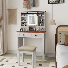 a bedroom with a vanity and stool in it