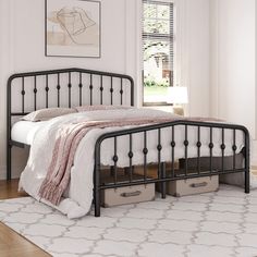 a black metal bed frame with two storage drawers under the headboard and foot board