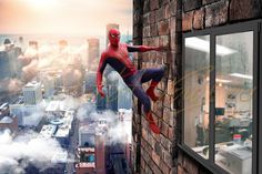 a spider - man hanging from the side of a brick building with cityscape in the background