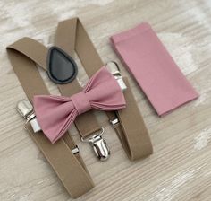 Your special guy will look so handsome when he shows up in his Dusty Rose bow tie, pocket square and Taupe suspenders!  Great set for groomsman, best man or ring bearers - This bow tie & suspenders set is a great choice for family photos, wedding, ring bearer outfit, birthday celebration or any other special occasion.  When making a purchase, you can choose from the following options : -Suspenders Only -Bow Tie Only. -Suspenders + Bow Tie Set. - Pocket Square only. -3 Pieces Set : bow tie + susp Dusty Rose Wedding Ring Bearer, Ring Bearer Outfit Rustic, Dusty Rose Bow Tie, Boho Wedding Groomsmen, Outfit Birthday, Rustic Boho Wedding, Bearer Outfit, Wedding Gifts For Groomsmen, Bowtie And Suspenders