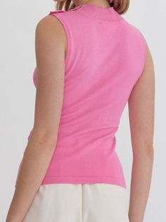 Add a touch of quirkiness to your wardrobe with the LYDIA HIGH NECK SLEEVELESS TOP. Featuring button detail at the shoulder and available in three fun colors, this knit top is perfect for those who don't take themselves too seriously. Style with your favorite jeans for a unique and fun outfit. 100% Nylon See size chart in photos. Chic Stretch Pink Knit Top, Pink Crew Neck Knit Top, Pink Fitted Crew Neck Tank Top, Pink Fitted Knit Top, Solid V-neck Knit Top For Summer, Solid Scoop Neck Knit Top For Spring, Pink Fitted Fine Knit Top, Scoop Neck Knit Top For Spring, Spring Pink Crew Neck Tank Top