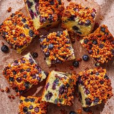 several pieces of blueberry cheesecake on a plate