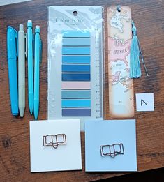 the contents of a crafting kit including pens, paper clips, and notebooks