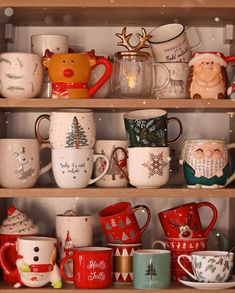 a shelf filled with lots of different colored coffee cups and mugs on top of each other