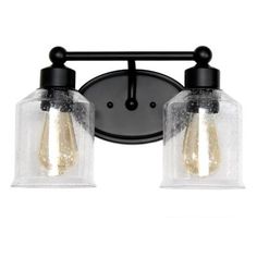 two light bathroom fixture with clear glass shades and black metal frame, on an isolated wall