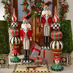 christmas decorations are displayed in front of a door