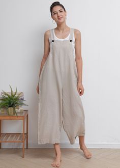 "From design to tailoring, we made this jumpsuit simple but comfortable, 100% linen fabric let your skin soft and breathy, you will feel comfy all time in summer. ★★FEATURES 100% Linen Two side pockets Button closure Casual linen jumpsuit Wide leg jumpsuit Cropped linen jumpsuit Perfect for Summer ★★ Model Size Height approx 162 cm (5′ 4″) Bust 84 cm (33\") Waist 66 cm (26\") She wears size XS. ★★ Bespoke Order Service If you Request other color Request the length Your height is not between 155 Linen Jumpsuits For Women, Cotton Jumpsuits For Women, Linen Jumpsuit Outfit, Linen Jumper, Women Overalls, Overalls Summer, Linen Overalls, Jumpsuit Wide Leg, Jumpsuit Casual