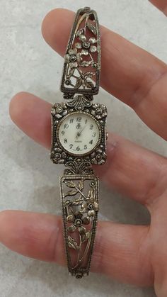 Beautiful looking sterling silver ladies watch. Dimensions  Lug width  mm Case diameter 20.9 mm Case Height  28.6mm Face/Dial diameter 16.8  mm including round border Condition  In excellent condition with little/ minor wear to case and crystal. Has some nice pattina. The watch can be polished if you so wish Vintage Silver Jewelry And Watches For Gifts, Antique Engraved Silver Jewelry And Watches, Antique Silver Jewelry And Watches For Anniversary, Vintage Silver Jewelry And Watches For Anniversary, Vintage Silver Watches As Gifts, Silver Analog Jewelry And Watches As Gift, Vintage Silver Watches As A Gift, Antique Silver Watch With Metal Dial, Engraved Silver Round Jewelry And Watches