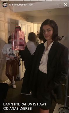 a woman standing in front of a blender with the words damn hydration is hawt