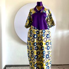 Elevate Your Fashion Sense With This Stunning Ankara Dress That Features An Ethnic Print In Alluring White And Black Colours. The Dress Has A Fabulous Long Length And Bell Sleeves That Add A Touch Of Elegance. It’s Perfect For Any Occasion, Whether It's A Wedding, Party, Cocktail, Casual Or Formal Event. Crafted From Premium Quality Viscose Material And Featuring A Chiffon Fabric Type, This Dress Is Machine Washable, Making It Easy To And Even Comes With Personalisation Options. The Dress Is Han Fitted Yellow Dress With Traditional Patterns, Traditional Yellow Kaftan With Floral Print, Yellow Batik Print Dresses, Traditional Purple Floral Print Dress, Traditional Floral Print Maxi Dress With Short Sleeves, Traditional Short Sleeve Maxi Dress With Floral Print, Traditional Short Sleeve Floral Maxi Dress, Traditional Yellow Dress With Batik Print, Traditional V-neck Maxi Dress With Batik Print